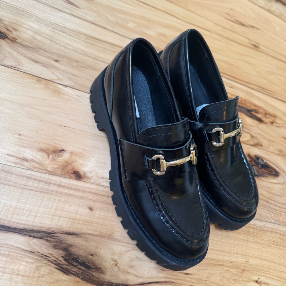Steve Madden Black Patent Lug Sole Loafers with Gold Bit